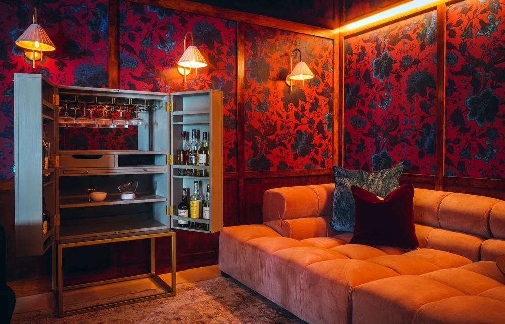 Flamingo Point amenity lounge with upholstered seating and accent lighting, multifamily interior design Miami